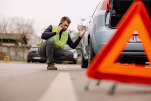 car owner changing tyre