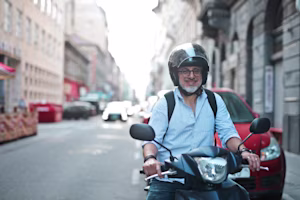 man riding scooter