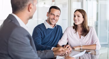 Woman on laptop with MoneySuperMarket logo displayed