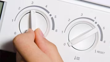 Woman on laptop with MoneySuperMarket logo displayed