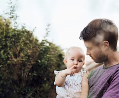 Dad with child in arms