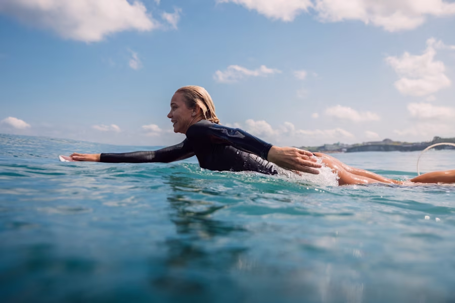 Woman on surf board in sea