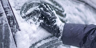 Woman on laptop with MoneySuperMarket logo displayed
