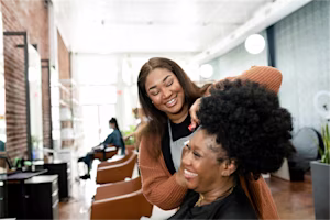 Woman on laptop with MoneySuperMarket logo displayed