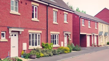Woman on laptop with MoneySuperMarket logo displayed
