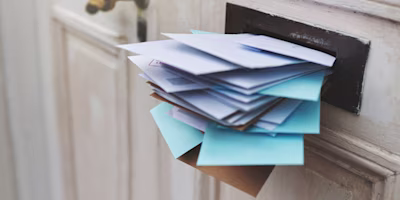 A letterbox stuffed full of letters