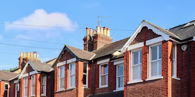 Victorian English houses under blue sky
