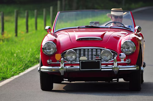 Man driving classic car