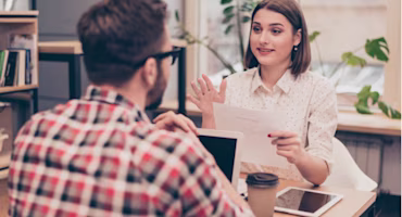 Woman on laptop with MoneySuperMarket logo displayed