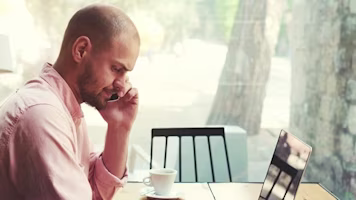 Woman on laptop with MoneySuperMarket logo displayed