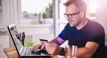 man using credit card