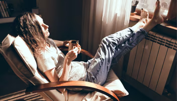 woman relaxing on a chair with her feet up