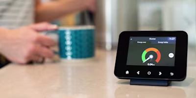 Woman on laptop with MoneySuperMarket logo displayed