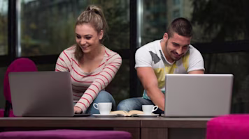 Woman on laptop with MoneySuperMarket logo displayed