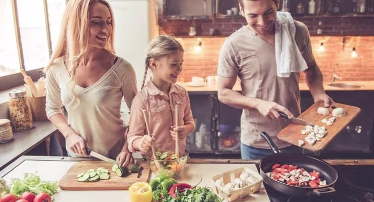 Family cooking in kitchen
