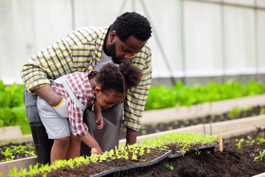 Dad gardening with daughter