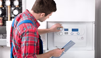 Man inspecting boiler controls