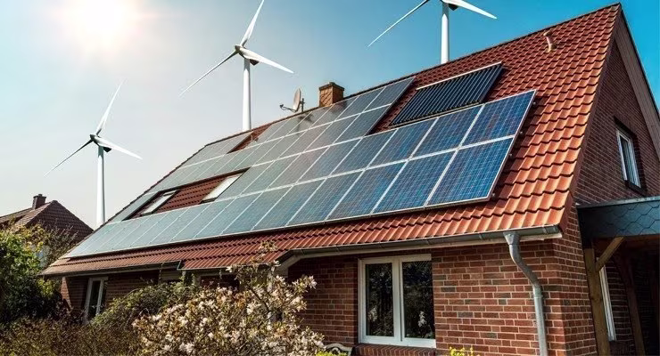 House with solar panels and wind turbines
