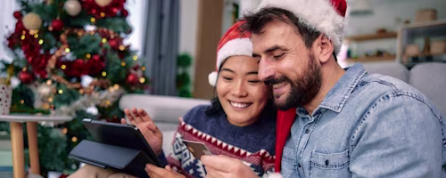 Woman on laptop with MoneySuperMarket logo displayed