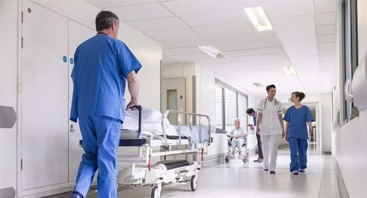 hospital staff moving beds