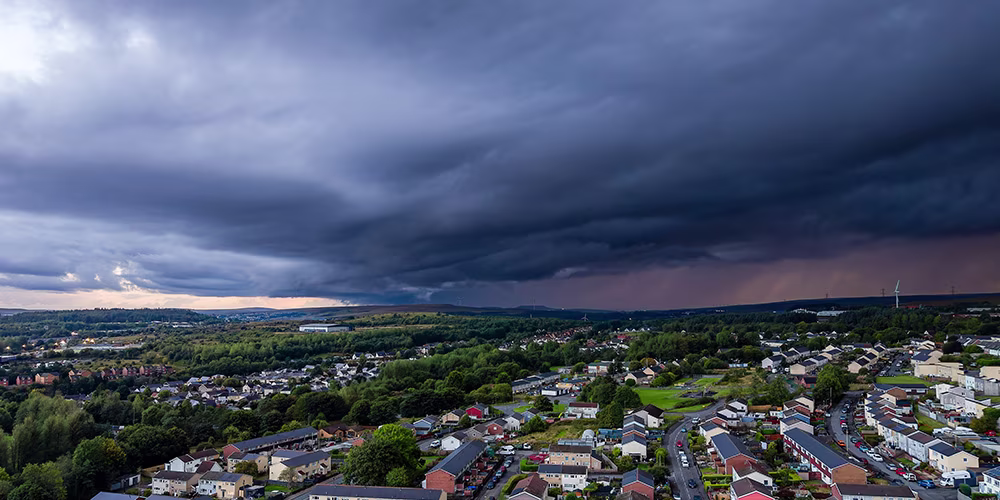 Storm clouds over a town in Wales
