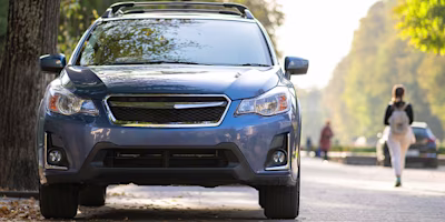 Woman on laptop with MoneySuperMarket logo displayed