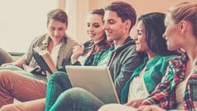 students with laptop