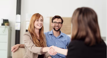 Woman on laptop with MoneySuperMarket logo displayed