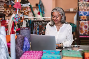 Female business owner at laptop