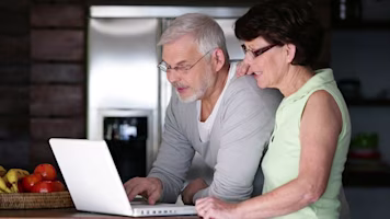 Man and woman on laptop