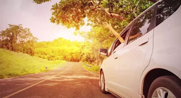 Woman on laptop with MoneySuperMarket logo displayed