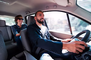 man and passenger in car