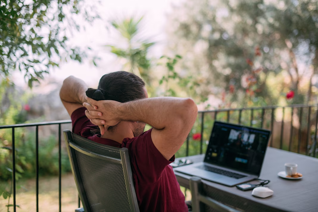 Broadband man in garden on laptop