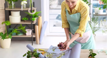 Woman on laptop with MoneySuperMarket logo displayed