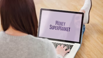 Woman on laptop with MoneySuperMarket logo displayed