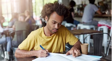 Woman on laptop with MoneySuperMarket logo displayed