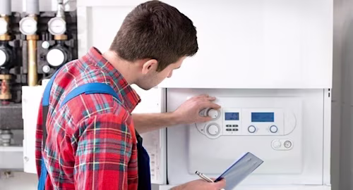 Technician servicing a boiler
