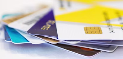 Woman on laptop with MoneySuperMarket logo displayed