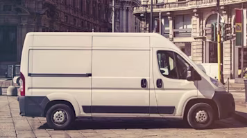 White van in street