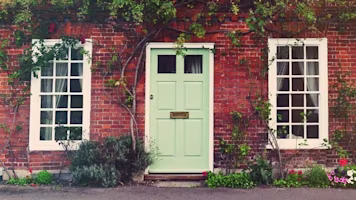 Woman on laptop with MoneySuperMarket logo displayed
