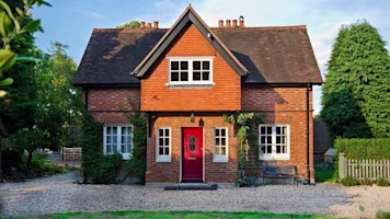 Woman on laptop with MoneySuperMarket logo displayed