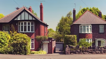 Two detached houses on a sunny day