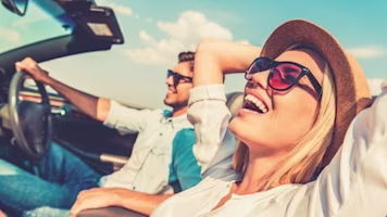 Woman on laptop with MoneySuperMarket logo displayed