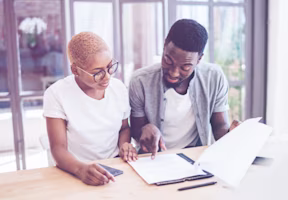 Woman on laptop with MoneySuperMarket logo displayed