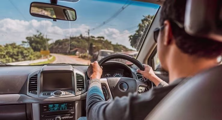 persona driving on the road