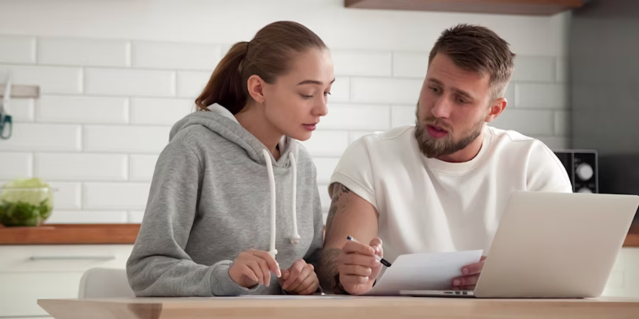 couple looking at credit statements