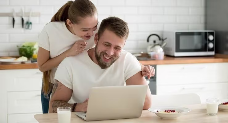Couple looking at laptop