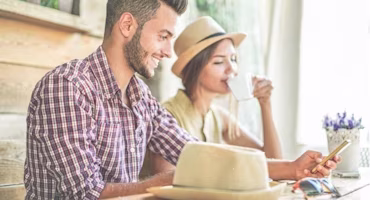 Woman on laptop with MoneySuperMarket logo displayed