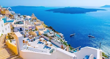 Woman on laptop with MoneySuperMarket logo displayed