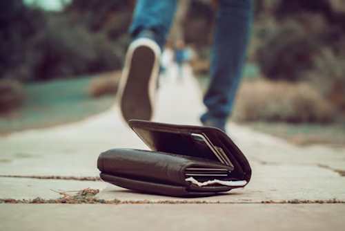 a wallet that has been dropped on the ground